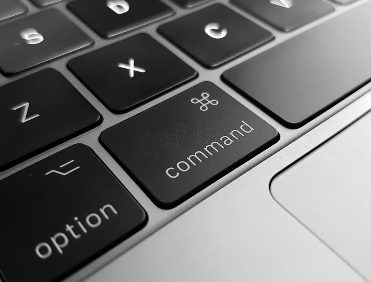 A Macbook Keyboard focusing on the option and command key.